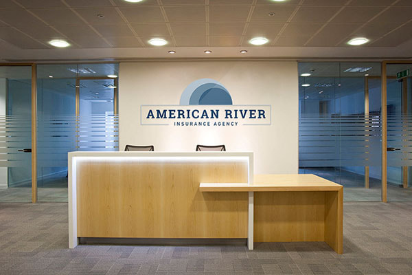 American River Insurance Agency LLC logo printed on the wall